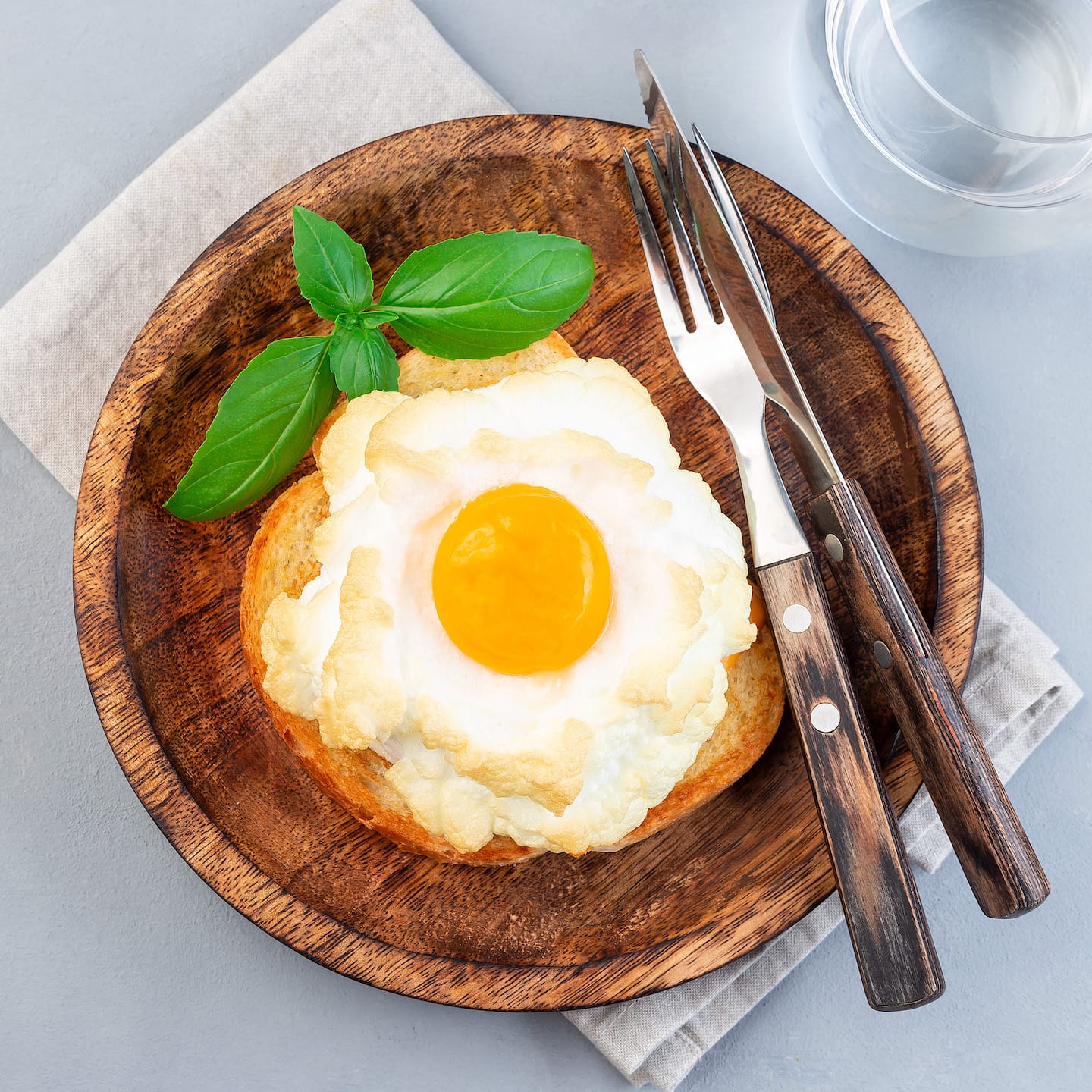 trendy-cloud-or-fluffy-egg-dish-on-wooden-plate-to-TFBWUKH